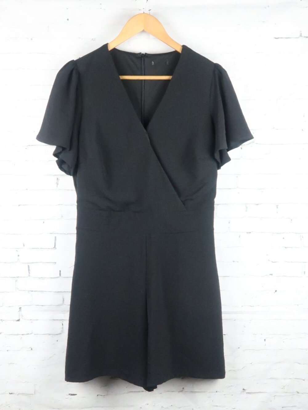 BLACK MOCK WRAP V NECK SHORT FLUTTER SLEEVE ROMPER SIZE MEDIUM
